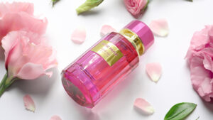 Bottle of perfume with flowers on white background; Shutterstock ID 769631026; Purchase Order: SHE Media; Job: ; Client/Licensee: ; Other: